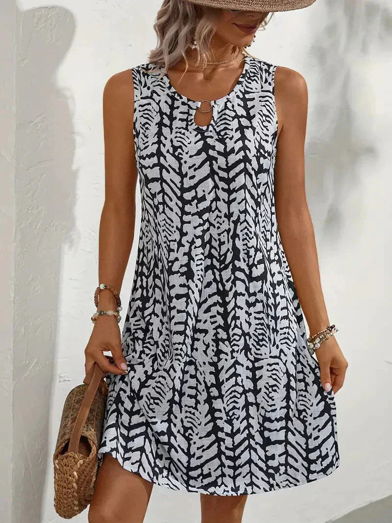 Yselda Robe Mini Femme – Robe d'Été Sans Manches avec Imprimé Élégant et Tissu Léger Respirant